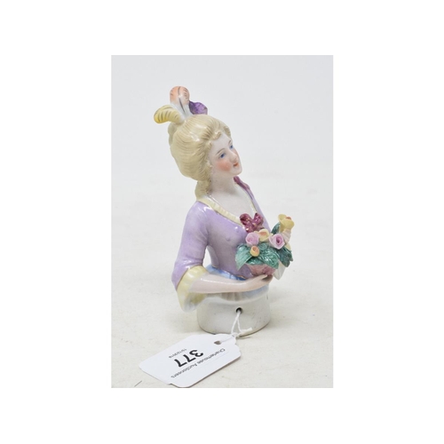 377 - A porcelain half doll, lady with light coloured hair with three feathers and wearing a lilac dress, ... 