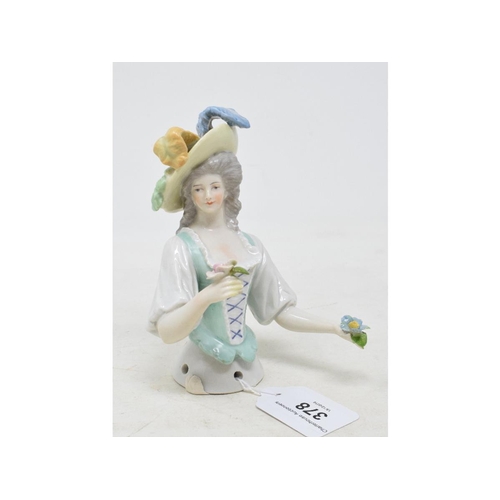 378 - A porcelain half doll, lady wearing a yellow plumed hat and a green and white dress, holding posies,... 