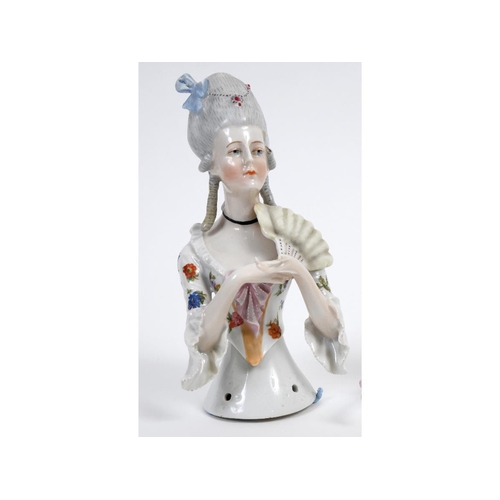 380 - A porcelain half doll, probably Goebel, lady with elaborate grey hair and a white dress with floral ... 