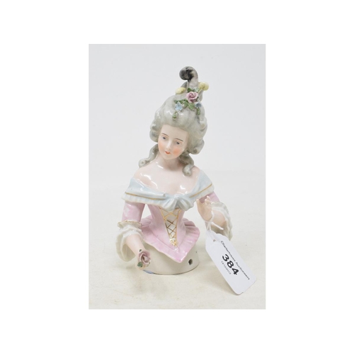 384 - A porcelain half doll, grey hair with flowers and feathers, pink and light blue dress, arms out, imp... 