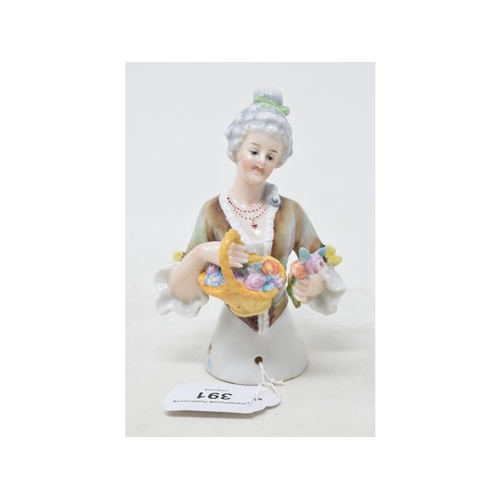 391 - A porcelain half doll, lady with grey hair wearing a brown mottled dress, holding a basket of flower... 