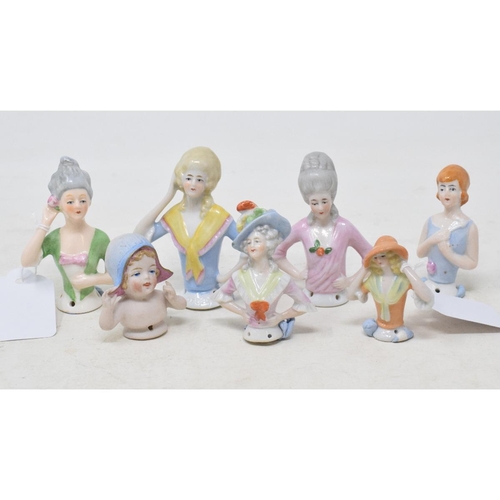 455 - Seven porcelain half dolls, the tallest 8 cm (7)