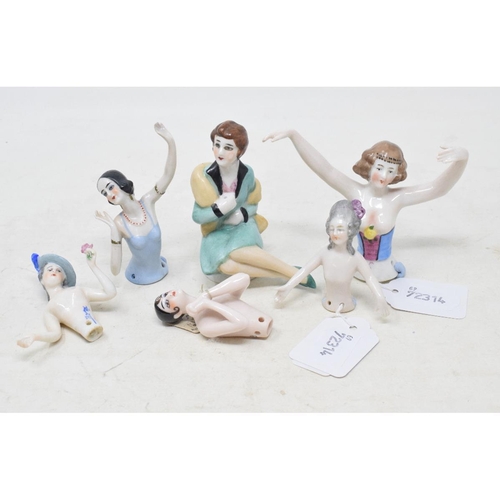 539 - An Art Deco porcelain half doll, dancer with short black bob and blue dress, arms up, impressed no. ... 