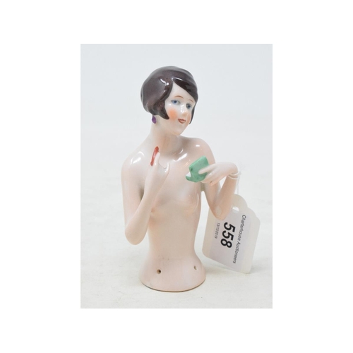 558 - A Hertwig & Co porcelain half doll, nude lady with black bob hair, applying lipstick, 12 cm high