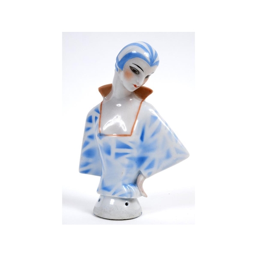 560 - An Art Deco porcelain half doll, lady with a blue stripped cap and matching dress, impressed no. 137... 