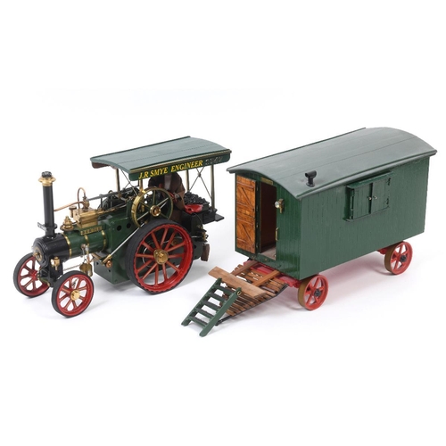 668 - A DRM live steam wagon, Bertie, in green livery, 32 cm long, and a showman's wagon with a well fitte... 