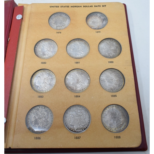 114 - An album of USA Morgan dollars, 1878-1904, and five others