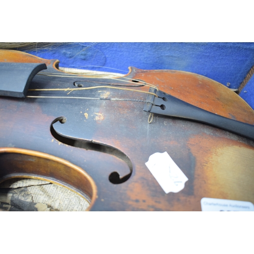 637 - A violin, having a two piece 36 cm back, with two bows, cased