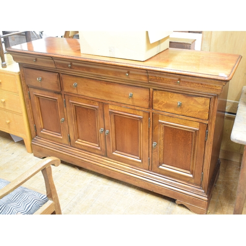 1137 - A mirror backed sideboard, 171 cm wide