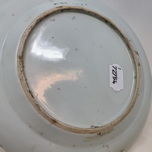 261 - A pair of Chinese porcelain plates, decorated dragons chasing flaming pearls, flowers and foliage, a... 