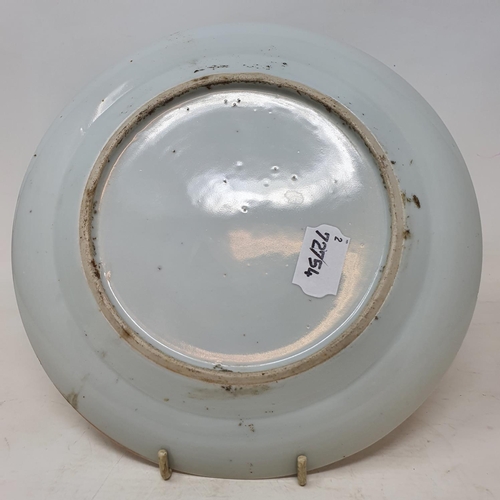 261 - A pair of Chinese porcelain plates, decorated dragons chasing flaming pearls, flowers and foliage, a... 