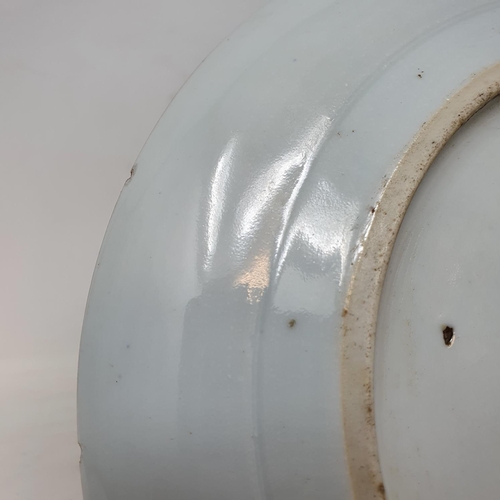 261 - A pair of Chinese porcelain plates, decorated dragons chasing flaming pearls, flowers and foliage, a... 