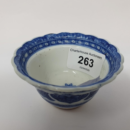 263 - An 18th century Chinese blue and white tea bowl, with scalloped border with hand painted and moulded... 