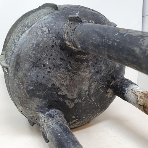 284 - A Chinese bronze censer, with twin handles, decorated clouds and other motifs, on three legs, 27 cm ... 