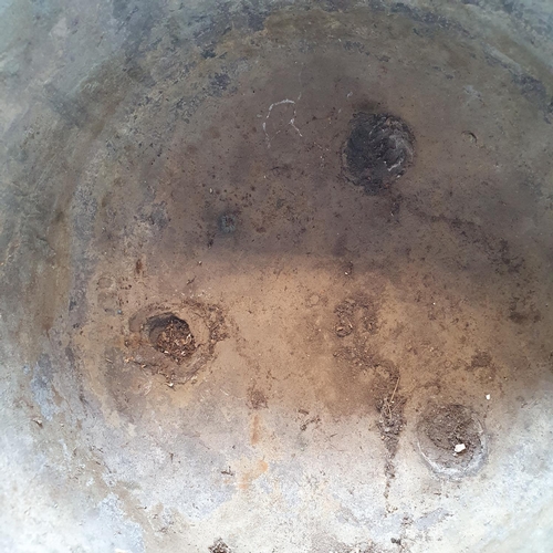 284 - A Chinese bronze censer, with twin handles, decorated clouds and other motifs, on three legs, 27 cm ... 