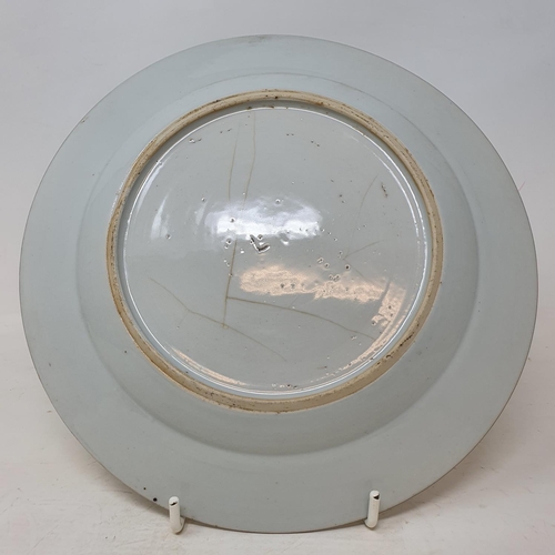 292 - A set of four Chinese porcelain famille rose plates, of shaped circular form, decorated flowers and ... 