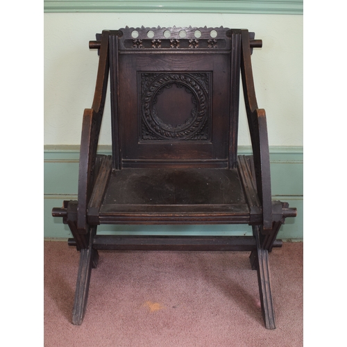 30 - A Glastonbury carved oak armchair, removal cost B