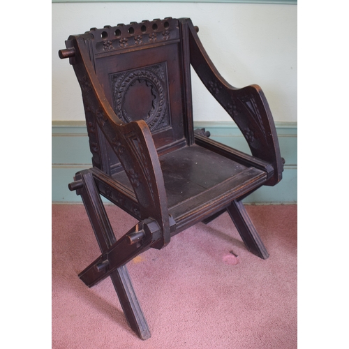 30 - A Glastonbury carved oak armchair, removal cost B