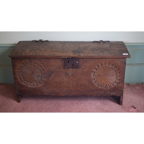 11 - A 17th century carved oak six plank coffer, with later blacksmith made shaped iron hinges, 93 cm wid... 