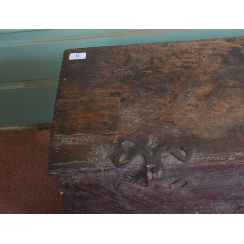 11 - A 17th century carved oak six plank coffer, with later blacksmith made shaped iron hinges, 93 cm wid... 