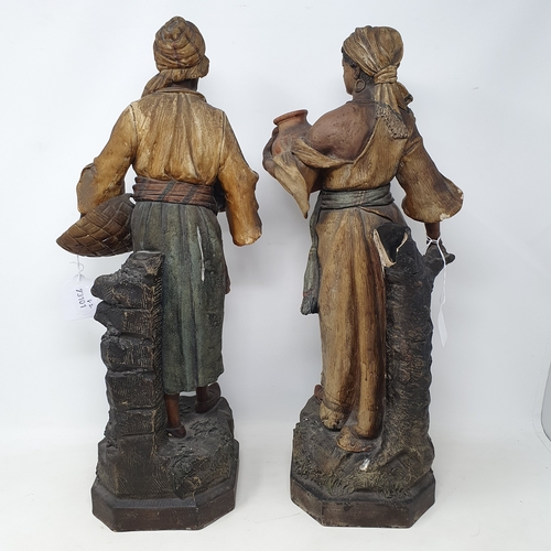 26 - A pair of earthenware Moorish type figures, the water carrier and the fruit carrier, slight damage, ... 