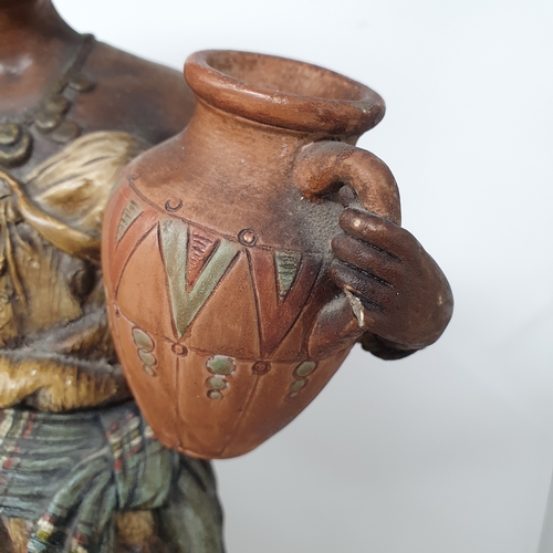 26 - A pair of earthenware Moorish type figures, the water carrier and the fruit carrier, slight damage, ... 