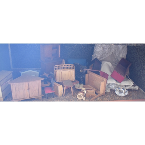 121 - A late 19th/early 20th century three storey doll's house, No 5, with a large group of assorted furni... 