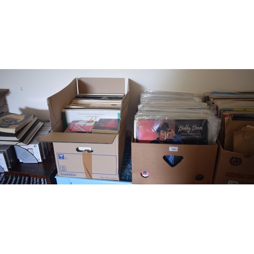 144 - A large quantity of assorted 33 rpm records, including country and western, film and others, a group... 