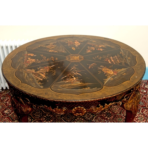 146 - A lacquered centre table, in the 18th century taste, with chinoiserie style decoration, on leaf carv... 