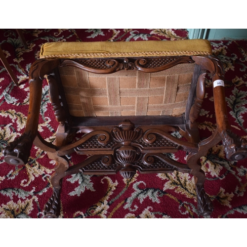 98 - A Queen Anne style carved walnut stool, on cabriole legs with hairy paw feet, 60 cm wide, removal co... 