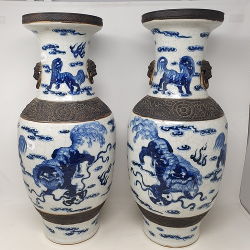 178 - A large pair of Chinese crackle glazes vases, of baluster form, decorated with horizontal bands of D... 