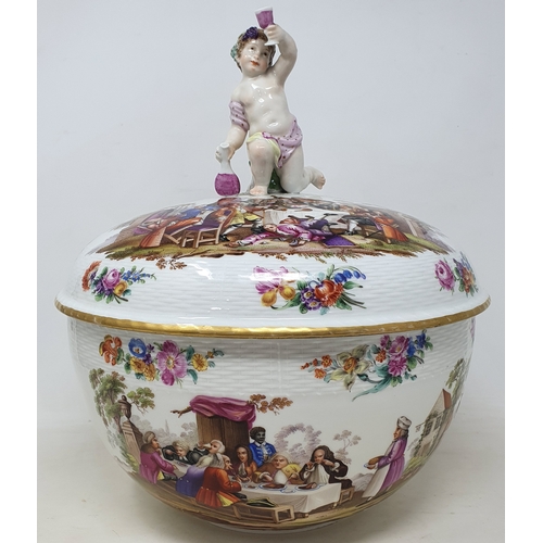 179 - A Berlin porcelain punch bowl and cover, with a putto finial, decorated extensive scenes of figures ... 