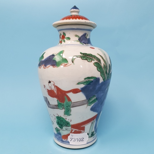 187 - A Chinese vase and cover, decorated figures, 22 cm high, removal cost A