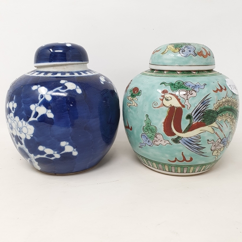 176 - A Chinese blue and white ginger jar, decorated blossom, 15 cm high and a famille verte ginger jar, 1... 