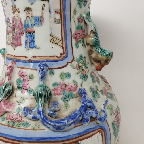 180 - A Chinese famille rose vase, of baluster form, decorated four rectangular cartouches with figures su... 