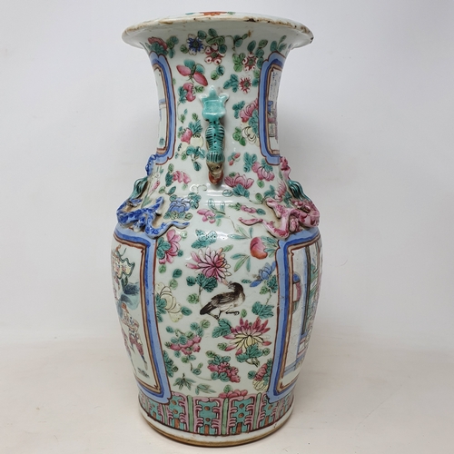 180 - A Chinese famille rose vase, of baluster form, decorated four rectangular cartouches with figures su... 