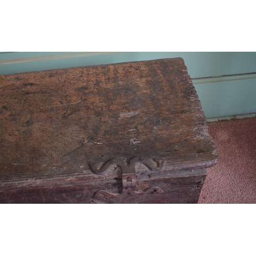 11 - A 17th century carved oak six plank coffer, with later blacksmith made shaped iron hinges, 93 cm wid... 