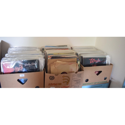 144 - A large quantity of assorted 33 rpm records, including country and western, film and others, a group... 