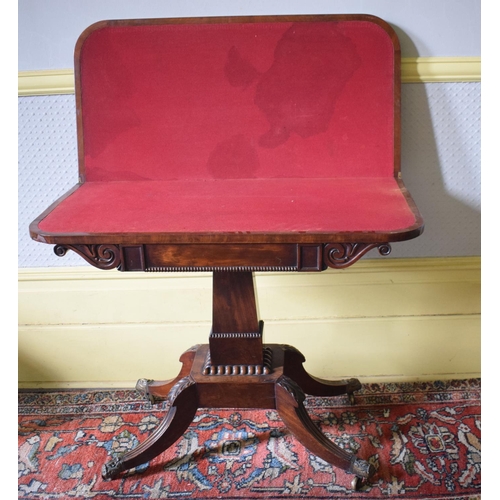 157 - A Regency mahogany D shaped card table, on a tapering column with four reeded downswept legs, 91 cm ... 