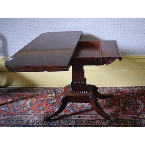 157 - A Regency mahogany D shaped card table, on a tapering column with four reeded downswept legs, 91 cm ... 