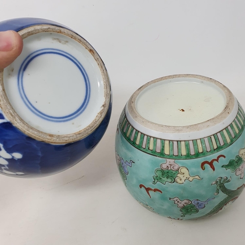 176 - A Chinese blue and white ginger jar, decorated blossom, 15 cm high and a famille verte ginger jar, 1... 