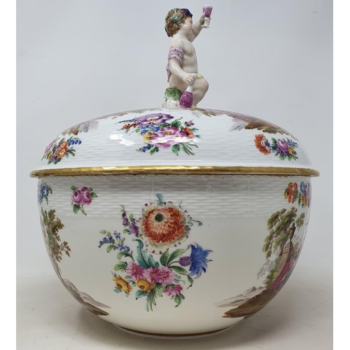 179 - A Berlin porcelain punch bowl and cover, with a putto finial, decorated extensive scenes of figures ... 