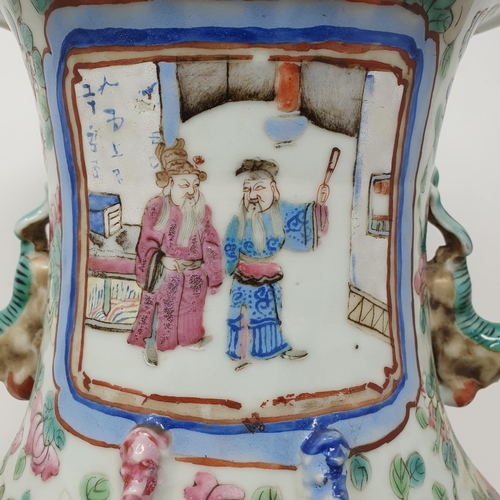 180 - A Chinese famille rose vase, of baluster form, decorated four rectangular cartouches with figures su... 