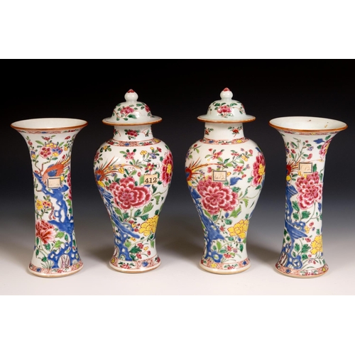 185 - A Chinese famille rose garniture of four vases, decorated flowering shrubs and exotic birds, compris... 