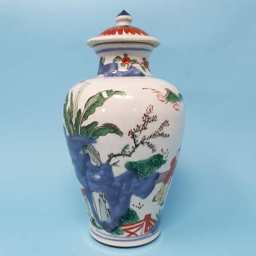 187 - A Chinese vase and cover, decorated figures, 22 cm high, removal cost A