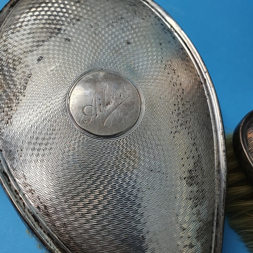 188 - A modern silver cigarette case, London 1953, and an  Edward VII silver dressing table set, Birmingha... 