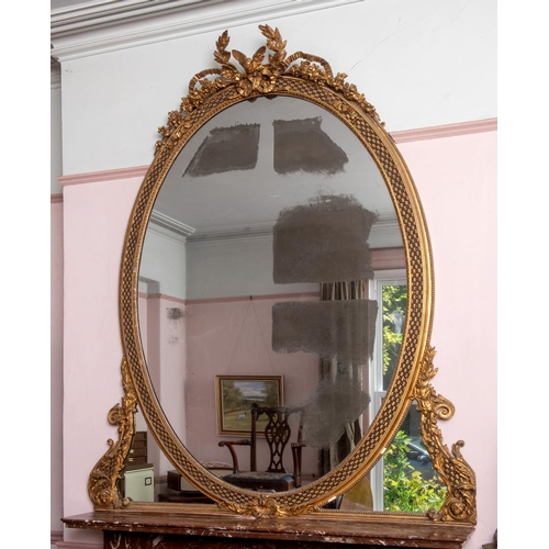 201 - A large pair of 19th century gilt gesso oval overmantel mirrors, each surmounted with a bird, a ribb... 