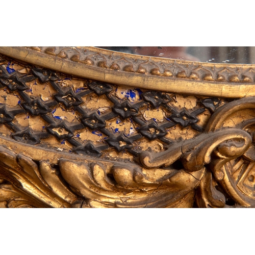 201 - A large pair of 19th century gilt gesso oval overmantel mirrors, each surmounted with a bird, a ribb... 