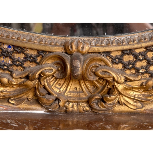 201 - A large pair of 19th century gilt gesso oval overmantel mirrors, each surmounted with a bird, a ribb... 