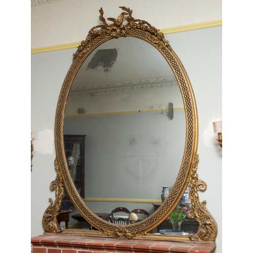 201 - A large pair of 19th century gilt gesso oval overmantel mirrors, each surmounted with a bird, a ribb... 